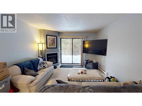 105A 1802 Alpine Drive, Elkford, BC - Indoor Photo Showing Living Room With Fireplace