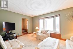 living room with bright front window - 