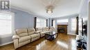 881 Knotty Pine Grove, Mississauga, ON  - Indoor Photo Showing Living Room With Fireplace 