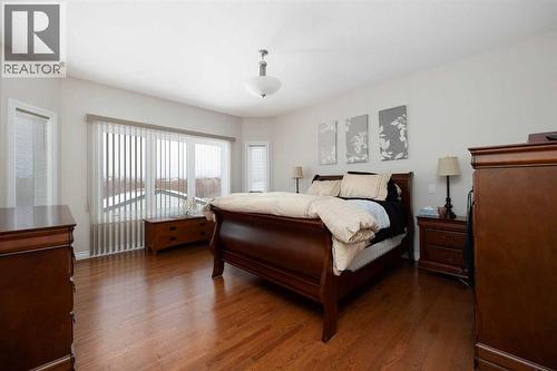 primary bedroom Hardwood floors - 237 Trillium Road, Fort Mcmurray, AB - Indoor Photo Showing Bedroom