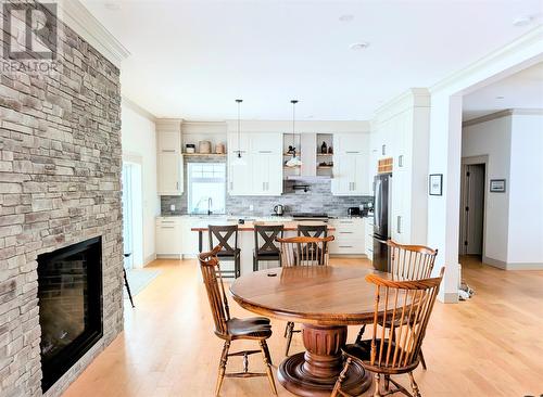 23 Main Road, Port Au Port, NL - Indoor Photo Showing Dining Room With Fireplace