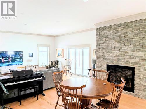 23 Main Road, Port Au Port, NL - Indoor Photo Showing Dining Room With Fireplace