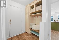 Spacious foyer with hall tree and access to garage - 