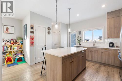 224 River Heights Drive, Cochrane, AB - Indoor Photo Showing Kitchen With Upgraded Kitchen