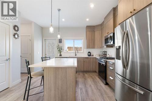 224 River Heights Drive, Cochrane, AB - Indoor Photo Showing Kitchen With Stainless Steel Kitchen With Upgraded Kitchen