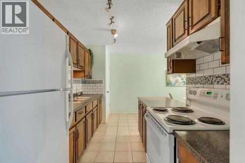 127 Falshire Way Ne, Calgary, AB - Indoor Photo Showing Kitchen