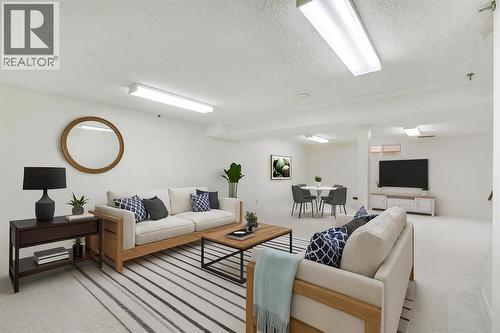 127 Falshire Way Ne, Calgary, AB - Indoor Photo Showing Living Room