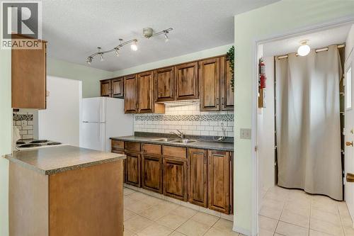 127 Falshire Way Ne, Calgary, AB - Indoor Photo Showing Kitchen With Double Sink