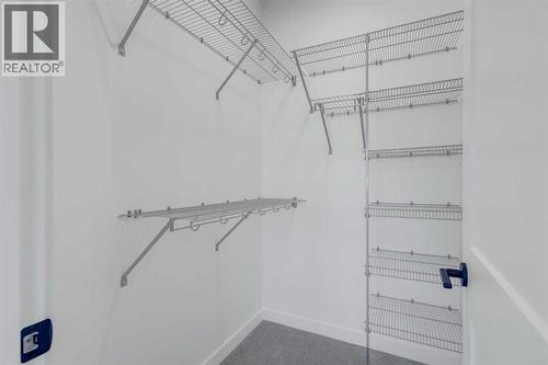 Walk in closet - 9 Ian Way, Sylvan Lake, AB - Indoor With Storage