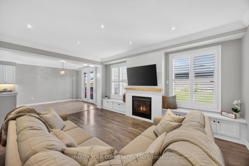 44 Cameron Street, Springwater, ON - Indoor Photo Showing Living Room With Fireplace