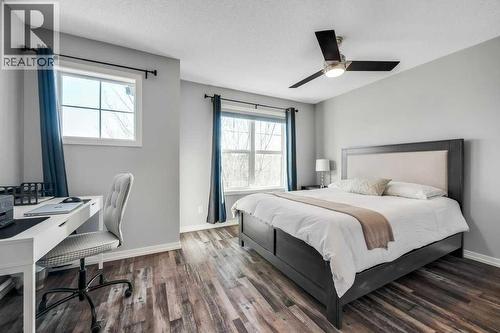 731, 101 Sunset Drive, Cochrane, AB - Indoor Photo Showing Bedroom