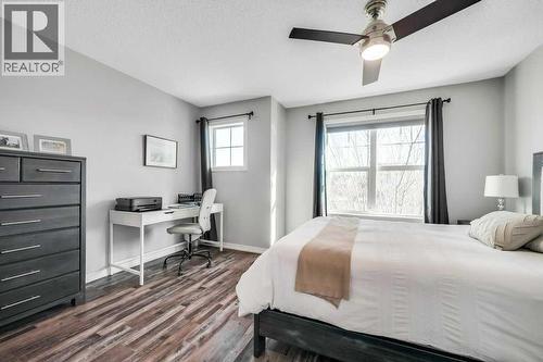 731, 101 Sunset Drive, Cochrane, AB - Indoor Photo Showing Bedroom