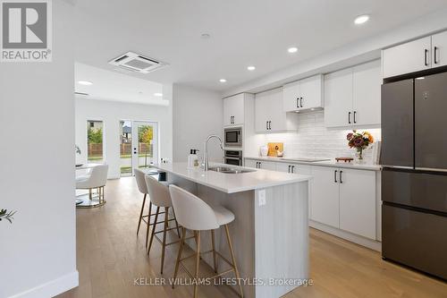 B117 - 2082 Lumen Drive, London South (South A), ON - Indoor Photo Showing Kitchen With Double Sink With Upgraded Kitchen