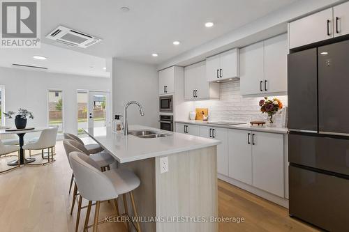 B117 - 2082 Lumen Drive, London South (South A), ON - Indoor Photo Showing Kitchen With Double Sink With Upgraded Kitchen
