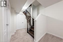 Stairway featuring carpet flooring and baseboards - 