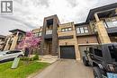 View of property featuring driveway and a garage - 391 Athabasca Common, Oakville, ON  - Outdoor 