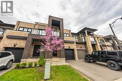 View of property featuring driveway - 