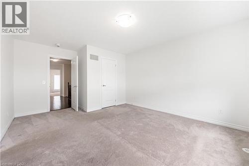 Unfurnished bedroom with light carpet and baseboards - 391 Athabasca Common, Oakville, ON - Indoor Photo Showing Other Room