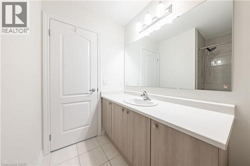 Bathroom featuring vanity, a tile shower, and light tile patterned floors - 391 Athabasca Common, Oakville, ON - Indoor Photo Showing Bathroom