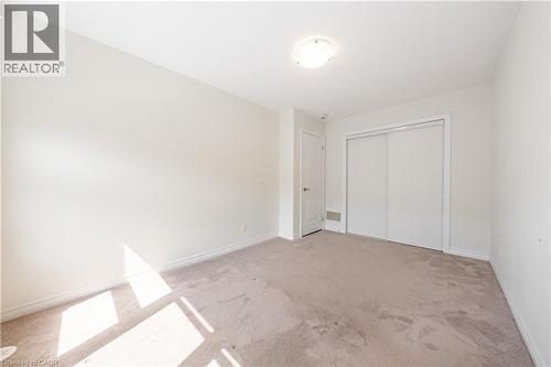 Unfurnished bedroom with light carpet and a closet - 391 Athabasca Common, Oakville, ON - Indoor Photo Showing Other Room
