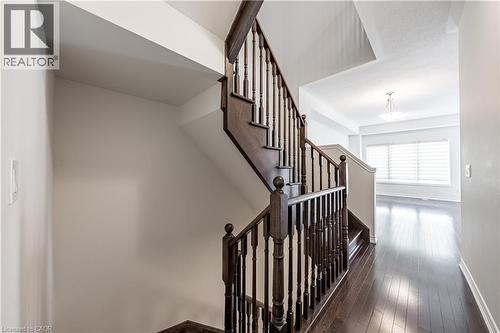 Stairway featuring hardwood / wood-style floors and baseboards - 391 Athabasca Common, Oakville, ON - Indoor Photo Showing Other Room