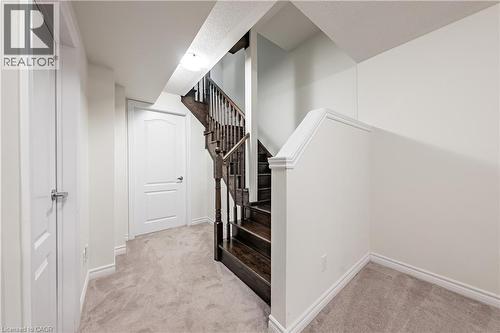 Stairway featuring carpet flooring and baseboards - 391 Athabasca Common, Oakville, ON - Indoor Photo Showing Other Room