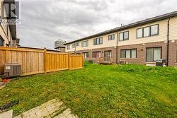 Rear view of property with brick siding - 