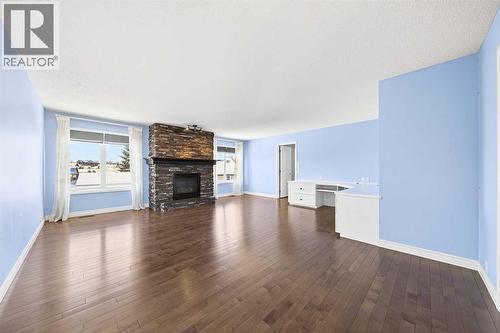 15209 Prestwick Boulevard Se, Calgary, AB - Indoor Photo Showing Living Room With Fireplace