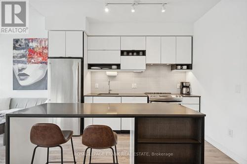 Kitchen with Island / Breakfast Bar - 407 - 4065 Confederation Parkway, Mississauga (City Centre), ON - Indoor Photo Showing Kitchen With Upgraded Kitchen