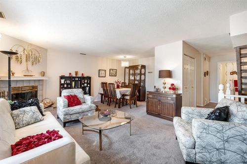 7 191 Hamilton Avenue, Winnipeg, MB - Indoor Photo Showing Living Room With Fireplace