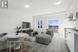 Living Room with Balcony (Virtually Staged) - 