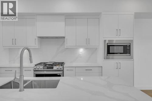 Photos may be of a similar home in the community - 5300 Main Street Unit# 121, Kelowna, BC - Indoor Photo Showing Kitchen With Double Sink With Upgraded Kitchen