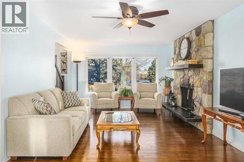 1315 Lake Michigan Crescent Se, Calgary, AB - Indoor Photo Showing Living Room With Fireplace