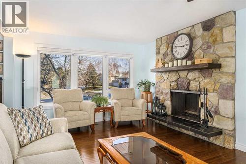1315 Lake Michigan Crescent Se, Calgary, AB - Indoor Photo Showing Living Room With Fireplace