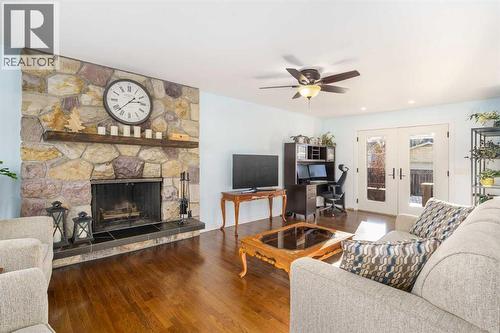 1315 Lake Michigan Crescent Se, Calgary, AB - Indoor Photo Showing Living Room With Fireplace