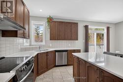 Ceramic tile backsplash 2 windows above sink - 