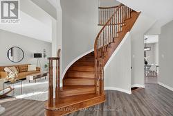 Beautiful oak staircase leads to upper level - 