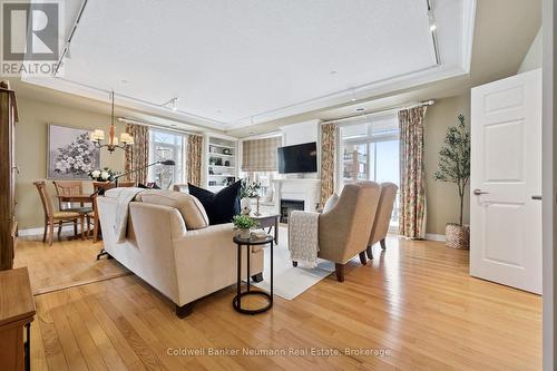 Unwind in the Classic Elegance of your Living Room - 202 - 65 Bayberry Drive, Guelph (Village By The Arboretum), ON - Indoor Photo Showing Living Room With Fireplace