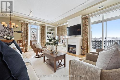 Beautiful Millwork, Custom Window Coverings - HOME - 202 - 65 Bayberry Drive, Guelph (Village By The Arboretum), ON - Indoor Photo Showing Living Room With Fireplace