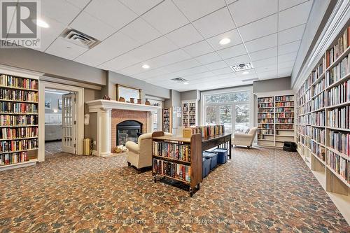 Community Centre, Library - 202 - 65 Bayberry Drive, Guelph (Village By The Arboretum), ON - Indoor Photo Showing Other Room With Fireplace