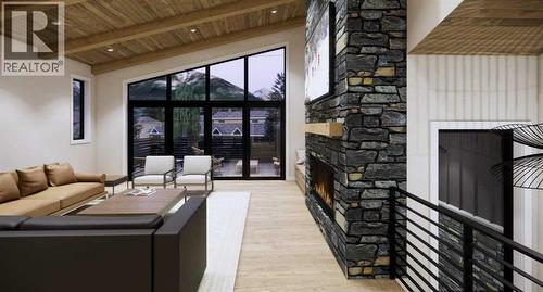 219B Three Sisters Drive, Canmore, AB -  With Fireplace With Exterior