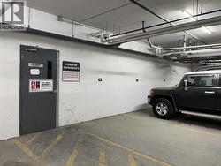 Parking stall #63, steps to storage room & locker #283 - 