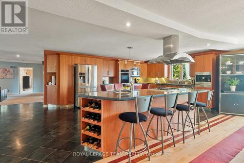 Cozy up to the extended breakfast bar. - 461 Campbells Side Road, Beckwith, ON - Indoor Photo Showing Kitchen With Upgraded Kitchen