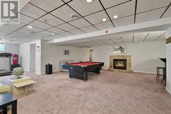 Games room with fireplace. - 