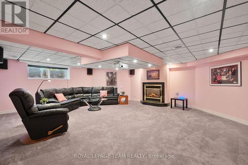 Home theatre with cozy fireplace. - 461 Campbells Side Road, Beckwith, ON - Indoor