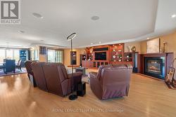 Massive great room finished with rich hardwood. - 