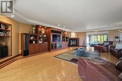 Custom built-ins and corner fireplace. - 