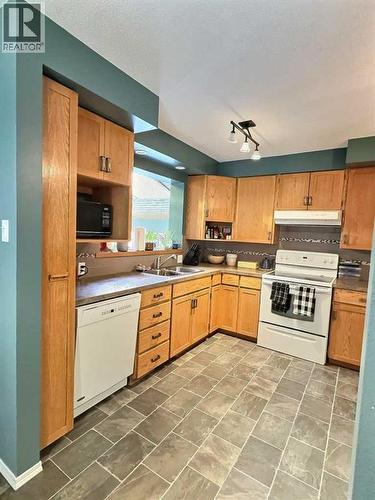 13 Aspen Crescent, Jasper, AB - Indoor Photo Showing Kitchen With Double Sink