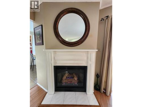 Cozy fireplace adds great ambiance - 4404 Pleasant Valley Road Unit# 6, Vernon, BC - Indoor Photo Showing Living Room With Fireplace