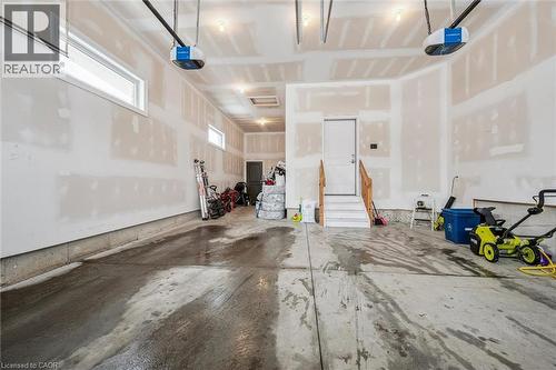Garage with a garage door opener - 263 Chestnut Ridge, Waterloo, ON - Indoor Photo Showing Garage
